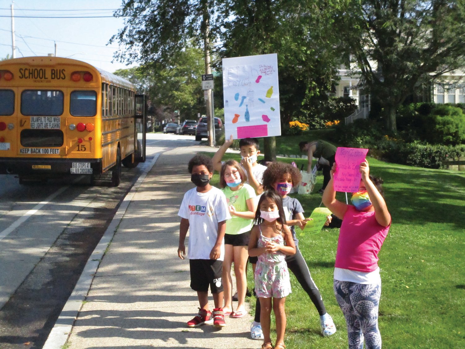 SHOW OF EXCITEMENT: Young participants in the STEM Advantage program wave to passers-by during their gathering at Stillhouse Cove last week.